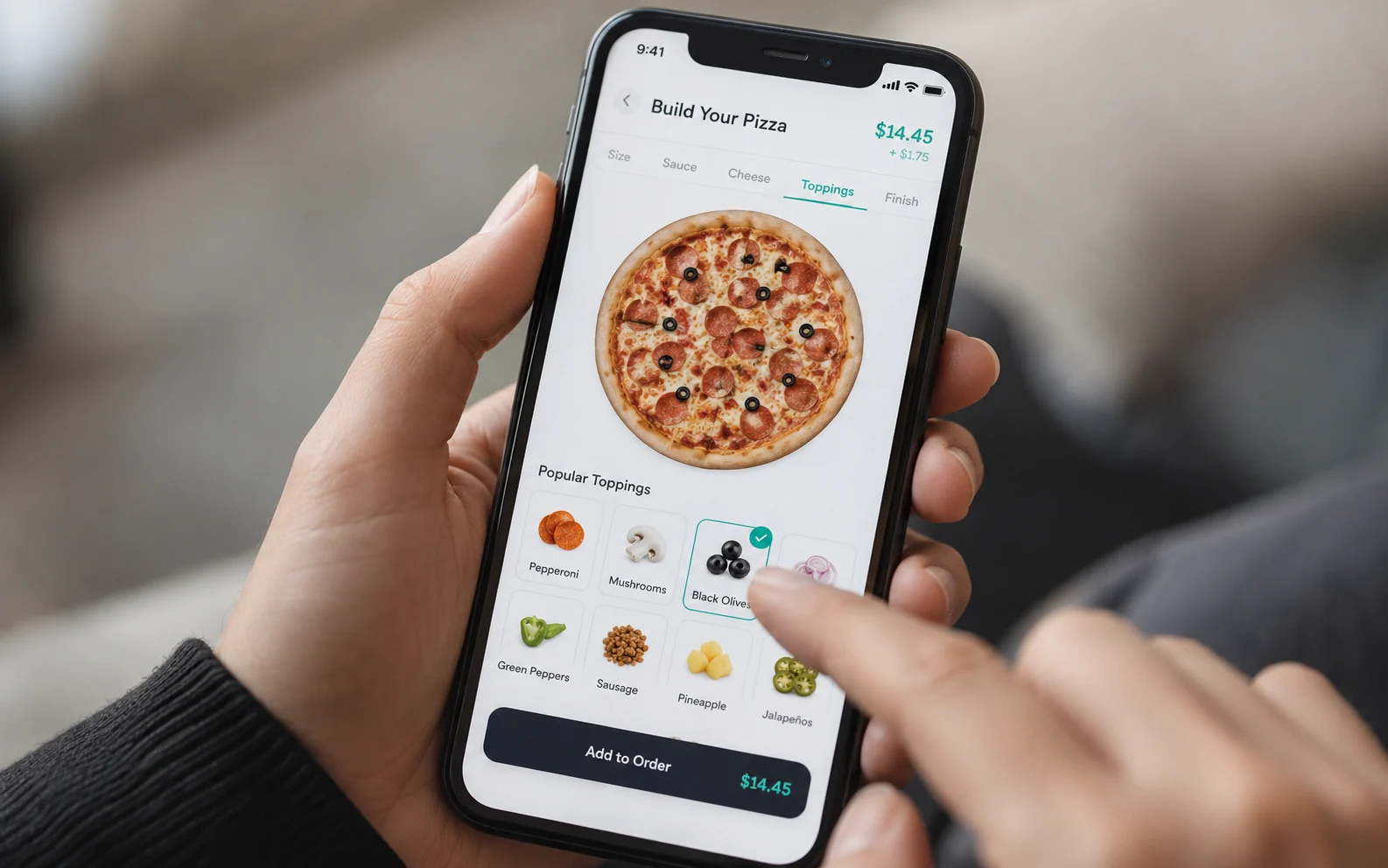 Food-ordering app updating a pizza preview in real time as a topping is tapped, showing how micro-interactions reduce cart abandonment