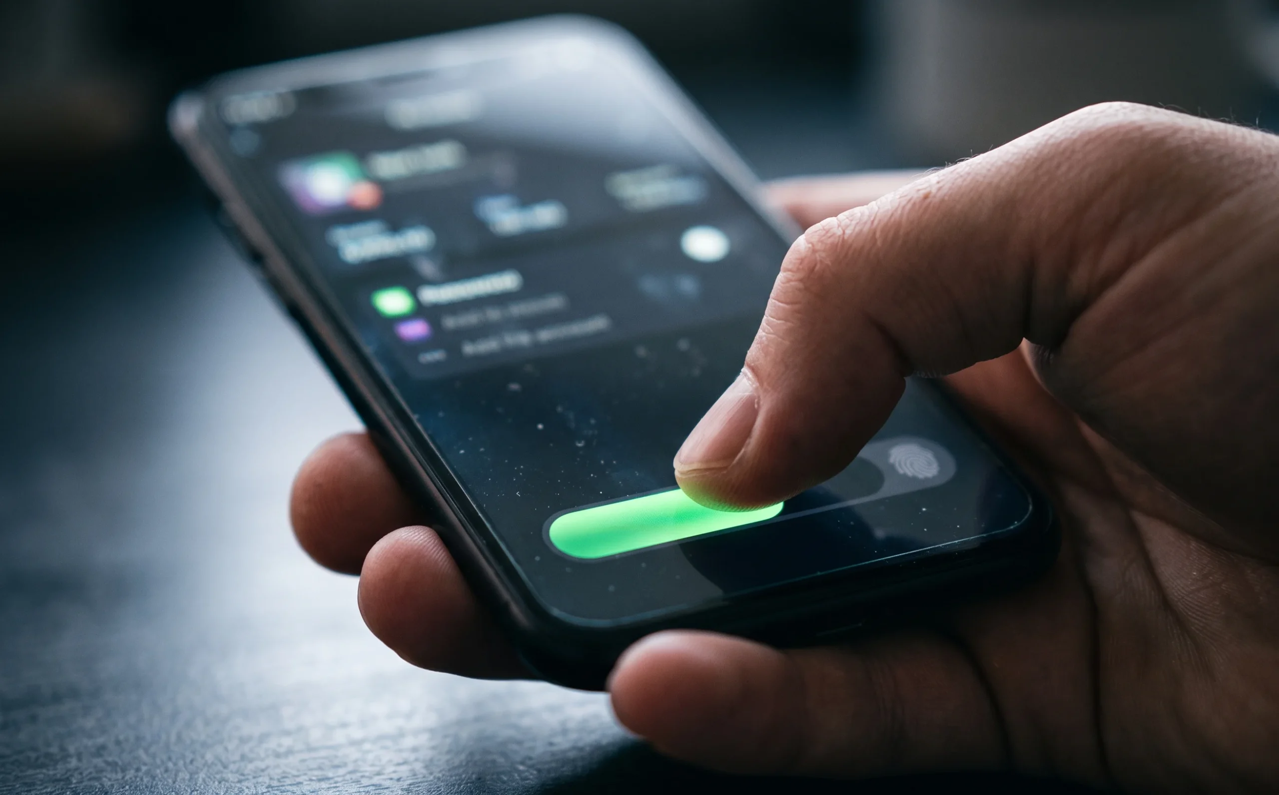 Thumb swiping a slide-to-confirm slider on a banking app, showing how smart friction builds trust in high-stakes transfers